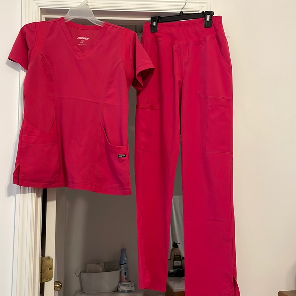 Hot pink scrub set size XS for both top and bottom.